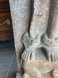 A large Indian red sandstone stupa pillar with a devata shown as a woman and lotus flowers, probably Matura region, ca. 2nd C. b.C - 2nd C.