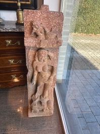 A large Indian red sandstone stupa pillar with a devata shown as a woman and lotus flowers, probably Matura region, ca. 2nd C. b.C - 2nd C.