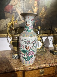 A Chinese famille rose vase with roosters among blossoming branches, 19th C.