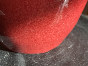 A Chinese monochrome oxblood-glazed bottle vase and a jar and cover, 19th C.