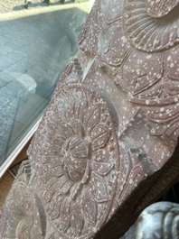 A large Indian red sandstone stupa pillar with a devata shown as a woman and lotus flowers, probably Matura region, ca. 2nd C. b.C - 2nd C.