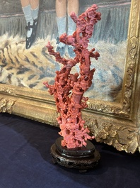 A Chinese red coral group of birds among blossoming branches on a silver-inlaid wooden stand, 19th/20th C.