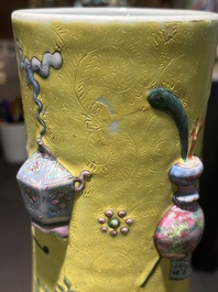 An exceptional pair of Chinese famille rose yellow sgraffito-ground bottle vases with applied design of antiquities, 19th C.