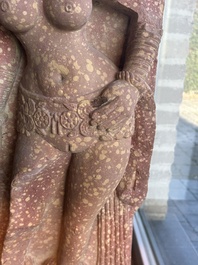 A large Indian red sandstone stupa pillar with a devata shown as a woman and lotus flowers, probably Matura region, ca. 2nd C. b.C - 2nd C.