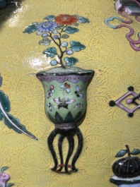 An exceptional pair of Chinese famille rose yellow sgraffito-ground bottle vases with applied design of antiquities, 19th C.