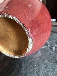 A Chinese monochrome oxblood-glazed bottle vase and a jar and cover, 19th C.