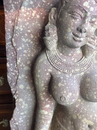 A large Indian red sandstone stupa pillar with a devata shown as a woman and lotus flowers, probably Matura region, ca. 2nd C. b.C - 2nd C.