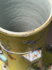 An exceptional pair of Chinese famille rose yellow sgraffito-ground bottle vases with applied design of antiquities, 19th C.