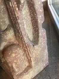 A large Indian red sandstone stupa pillar with a devata shown as a woman and lotus flowers, probably Matura region, ca. 2nd C. b.C - 2nd C.