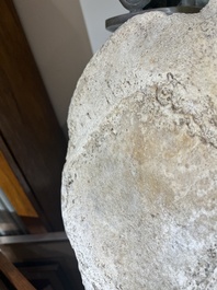 A large whale vertebra mounted on a wooden base, s.d.