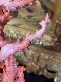 A Chinese red coral group of birds among blossoming branches on a silver-inlaid wooden stand, 19th/20th C.