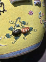 An exceptional pair of Chinese famille rose yellow sgraffito-ground bottle vases with applied design of antiquities, 19th C.