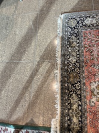 A Persian Qom (Qum/Ghom) silk rug with hunting scenes, 20th C.