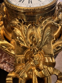A French gilt bronze Louis XVI style cartel clock with floral design, late 19th C.