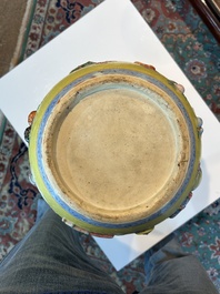 An exceptional pair of Chinese famille rose yellow sgraffito-ground bottle vases with applied design of antiquities, 19th C.