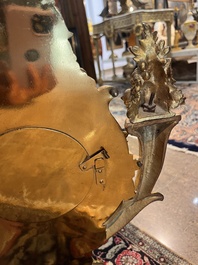 A French gilt bronze Louis XVI style cartel clock with floral design, late 19th C.