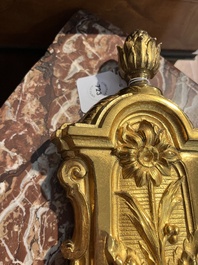 A French gilt bronze Louis XVI style cartel clock with floral design, late 19th C.