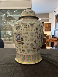 A Chinese famille rose 'antiquities' vase and cover, 19th C.