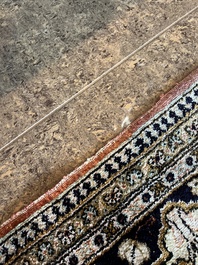 A Persian Qom (Qum/Ghom) silk rug with hunting scenes, 20th C.