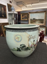 A Chinese famille rose fish bowl with ladies in a garden, 20th C.