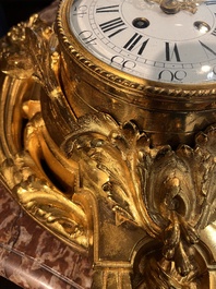 A French gilt bronze Louis XVI style cartel clock with floral design, late 19th C.