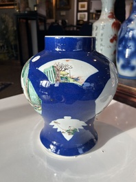 A Chinese famille verte powder blue ground vase with wooden cover, 19th C.