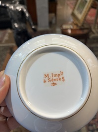 A 27-piece porcelain coffee service with the arms of the Second French Empire under Napoleon III, S&egrave;vres mark, France, 19th C.