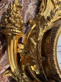 A French gilt bronze Louis XVI style cartel clock with floral design, late 19th C.