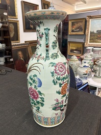 A Chinese famille rose vase with phoenixes and pheasants among blossoming branches, 19th C.