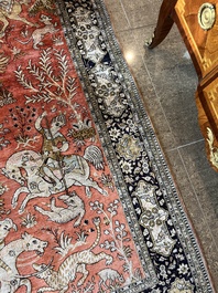 A Persian Qom (Qum/Ghom) silk rug with hunting scenes, 20th C.