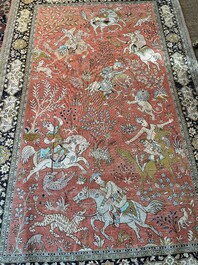 A Persian Qom (Qum/Ghom) silk rug with hunting scenes, 20th C.