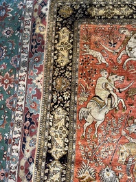 A Persian Qom (Qum/Ghom) silk rug with hunting scenes, 20th C.