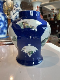 A Chinese famille verte powder blue ground vase with wooden cover, 19th C.