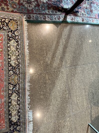 A Persian Qom (Qum/Ghom) silk rug with hunting scenes, 20th C.