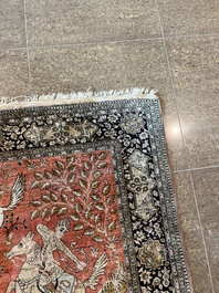 A Persian Qom (Qum/Ghom) silk rug with hunting scenes, 20th C.