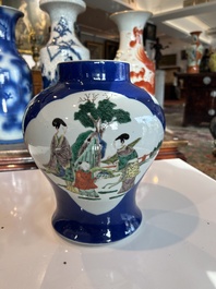 A Chinese famille verte powder blue ground vase with wooden cover, 19th C.