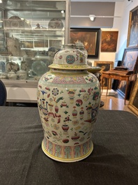 A Chinese famille rose 'antiquities' vase and cover, 19th C.