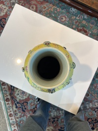 An exceptional pair of Chinese famille rose yellow sgraffito-ground bottle vases with applied design of antiquities, 19th C.