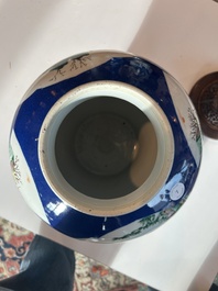 A Chinese famille verte powder blue ground vase with wooden cover, 19th C.