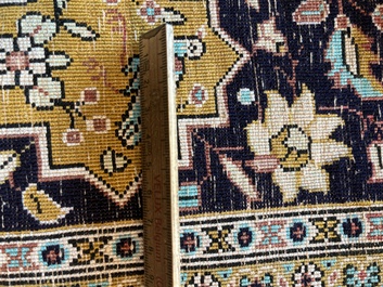 A Persian Qom (Qum/Ghom) silk rug with hunting scenes, 20th C.