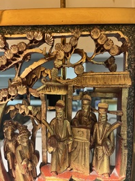 Two pairs of table lamps with South-Chinese reticulated gilt wooden carvings, 20th C.