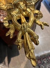 A French gilt bronze Louis XVI style cartel clock with floral design, late 19th C.