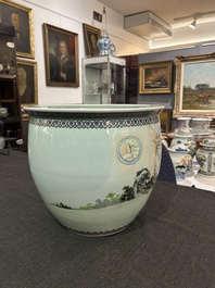 A Chinese famille rose fish bowl with ladies in a garden, 20th C.