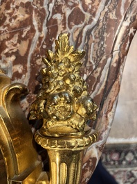 A French gilt bronze Louis XVI style cartel clock with floral design, late 19th C.