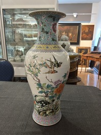 A Chinese famille rose baluster vase with birds among blossoming branches, Qianlong mark, Republic, 20th C.
