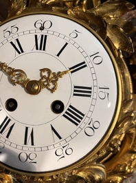 A French gilt bronze Louis XVI style cartel clock with floral design, late 19th C.