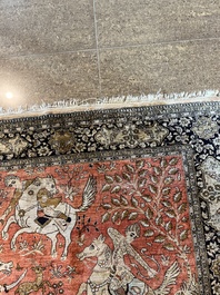 A Persian Qom (Qum/Ghom) silk rug with hunting scenes, 20th C.