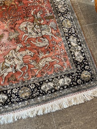 A Persian Qom (Qum/Ghom) silk rug with hunting scenes, 20th C.