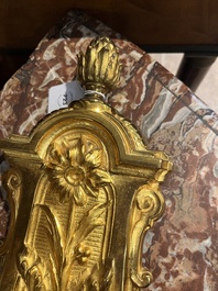 A French gilt bronze Louis XVI style cartel clock with floral design, late 19th C.