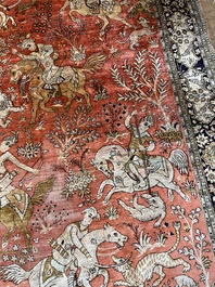 A Persian Qom (Qum/Ghom) silk rug with hunting scenes, 20th C.
